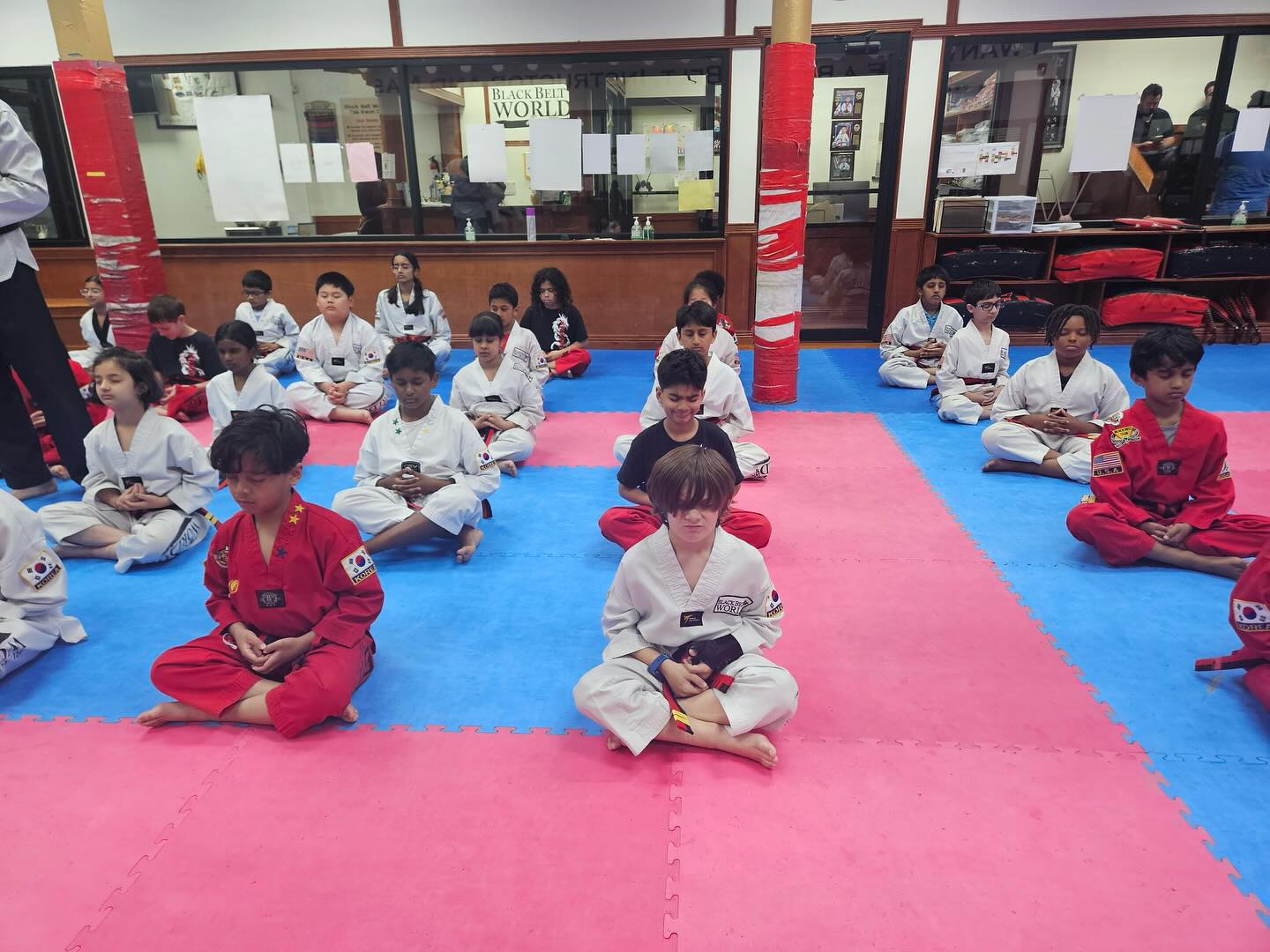 Children practicing Taekwondo forms together